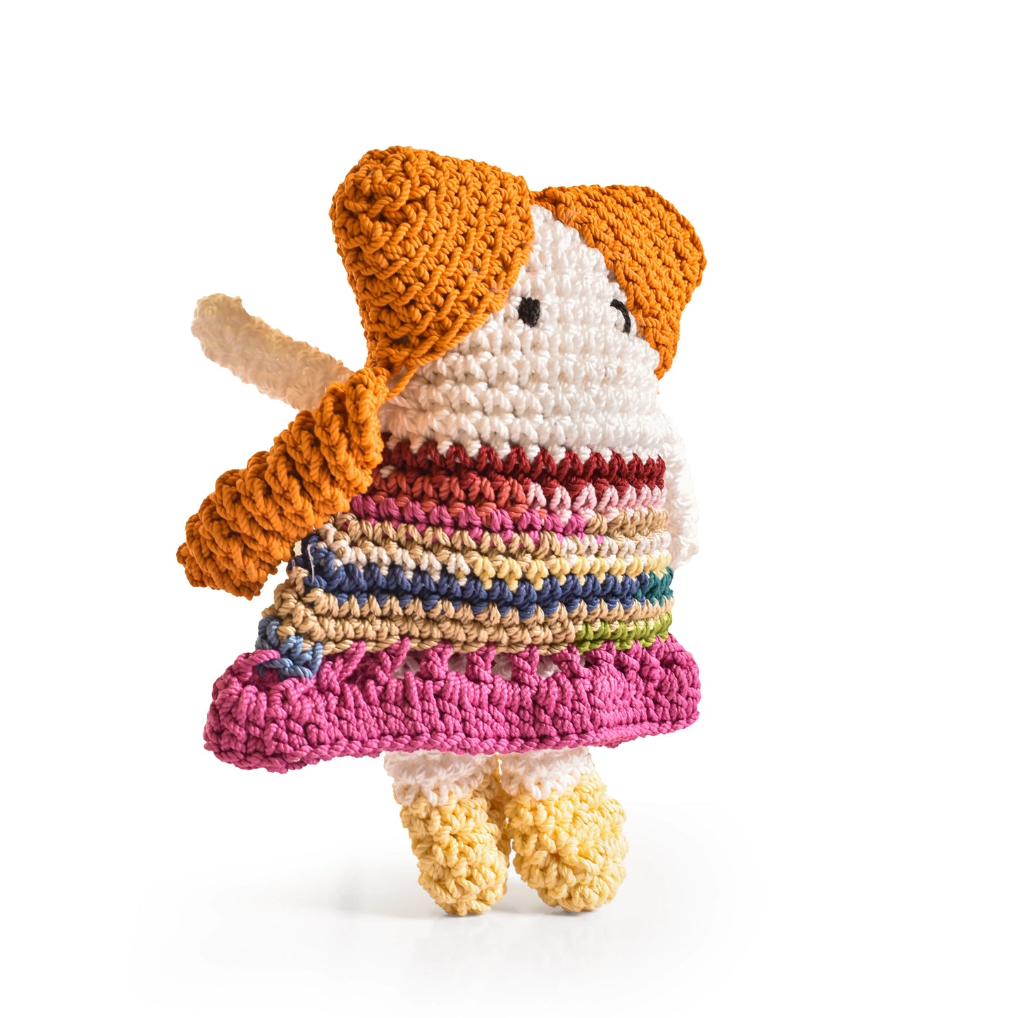 Crocheted doll with a colorful dress and orange hair 